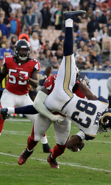 Ryan throws for 3 TDs, Falcons thrash faltering Rams 42-14